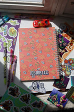 Load image into Gallery viewer, JobJob Reusable Sticker BookBook closed showing the JobJobLLC patterned cover with stickers and pens around it