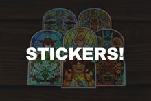 Load image into Gallery viewer, Sage Stickers full set of 8 holographic vinyl stickers featuring Zelda characters in stained-glass arch style displayed on wooden surface — 3x3 inch holographic stickers by NaZyrus07 for JobJobLLC