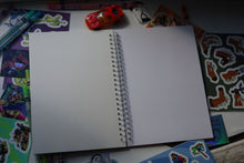 Load image into Gallery viewer, Blank open pages of the JobJob Reusable Sticker BookBook showing waxy blank canvas ready for sticker placement
